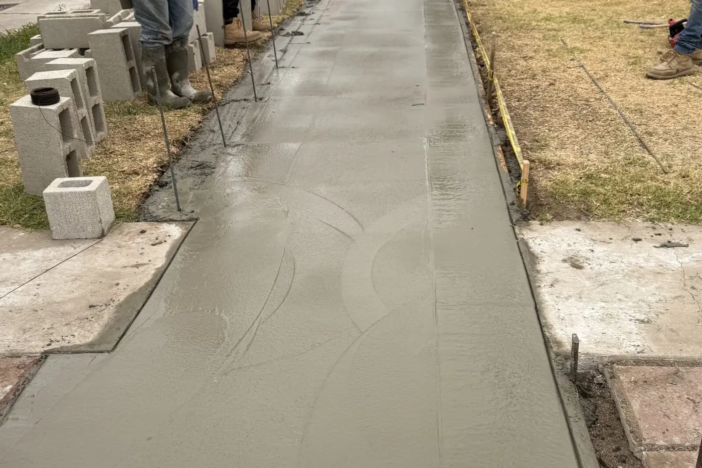 NexGen crew finishing a fresh concrete sidewalk in Huntington Beach, CA